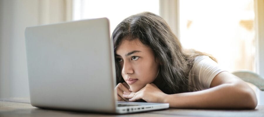 Young woman using laptop at home